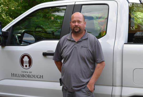 Brian Tatum standing in front of a white truck