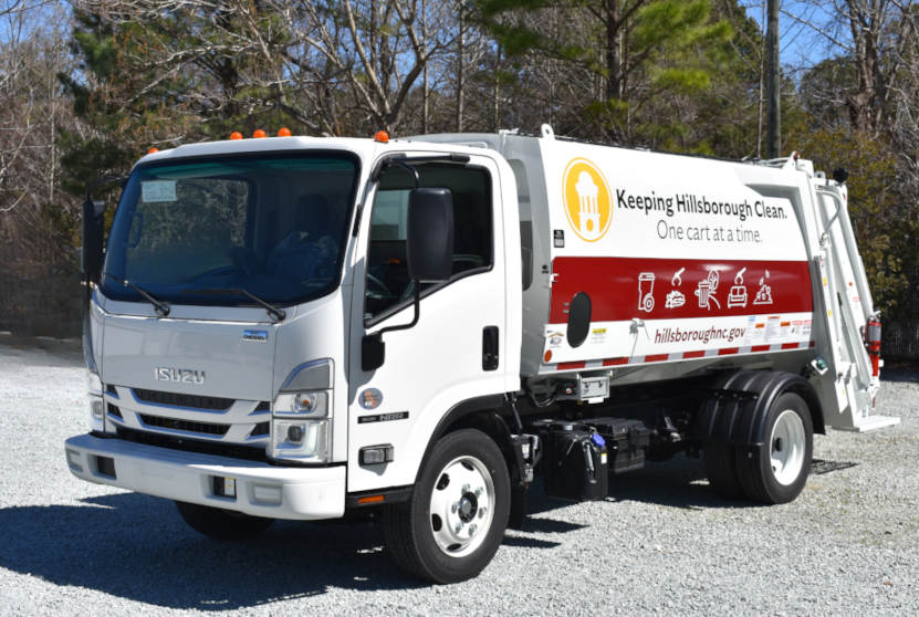 Garbage truck with the tagline Keeping Hillsborough Clean One Cart at a Time